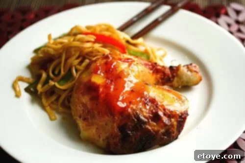 Roast Chicken with Sweet Plum Sauce Section of Roast Chicken dark meat with Sweet Plum Sauce, highlighting its rich color and texture