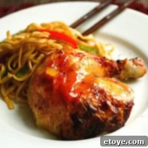 Sweet Plum Glazed Roast Chicken 3 Beautifully roasted chicken with sweet plum sauce, garnished and ready to be carved