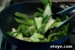 Bok Choy Recipe - Add leaves into wok