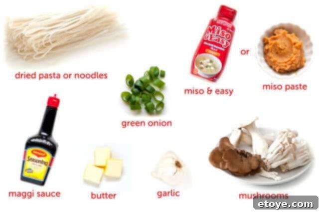 Garlic-Noodles-with-Miso-Butter-1 Closeup of garlic, green onions, and butter sizzling in a hot wok