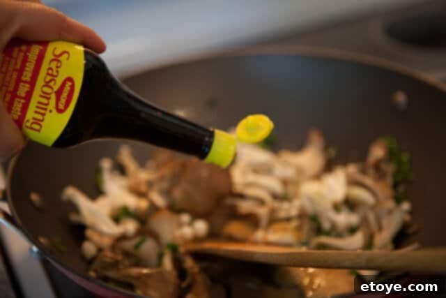 Miso Butter Garlic Noodles 5 Cooked noodles tossed with the miso butter and mushroom sauce in a wok