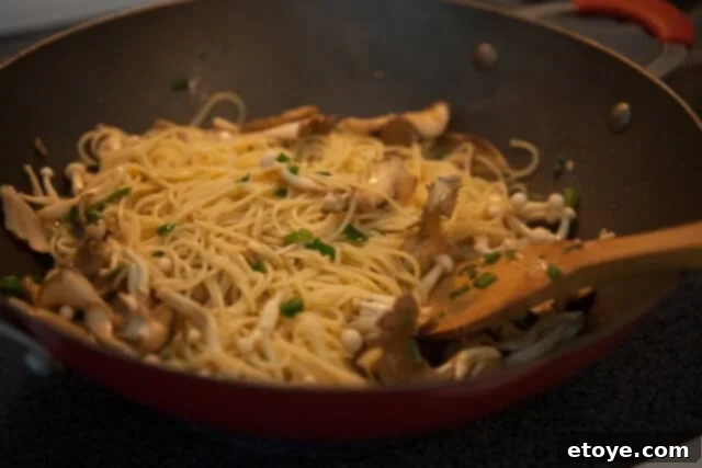 Miso Butter Garlic Noodles 7 Platter of finished garlic noodles with miso butter and mushrooms, ready to serve