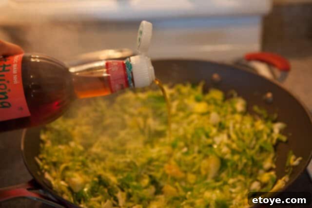 Stir-fried Brussels Sprouts with Chinese Sausage 7 Adding Fish Sauce to Brussels Sprouts
