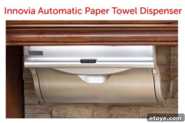 Innovia Automatic Paper Towel Dispenser in a modern kitchen setting, illustrating touchless convenience