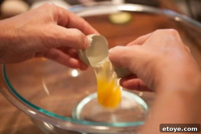 Cracking and whisking fresh eggs for the frittata