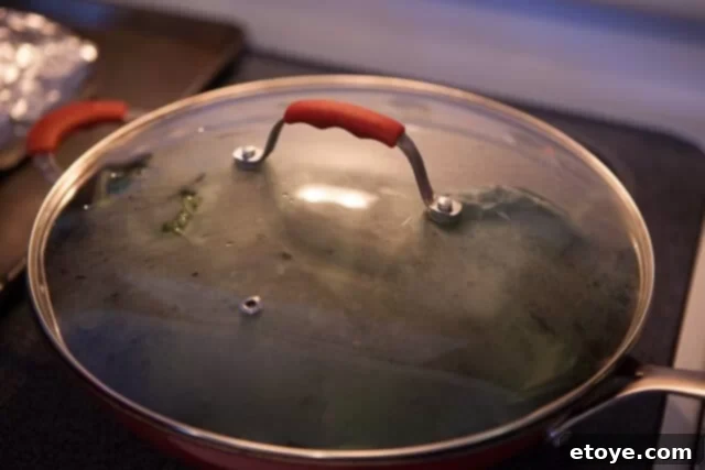 Chinese Broccoli Garlicky Ginger Miso Sauce Recipe lid on wok