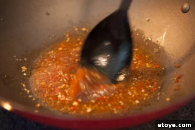 Chinese Broccoli Garlicky Ginger Miso Sauce Recipe aromatics in wok for chinese broccoli recipe