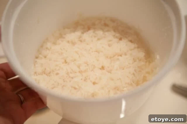Draining excess water from rinsed rice is an important step for microwave preparation
