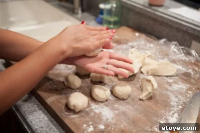 Forming Dough Balls for Steamed Buns Dough Balls - Small, smooth balls of dough on a surface