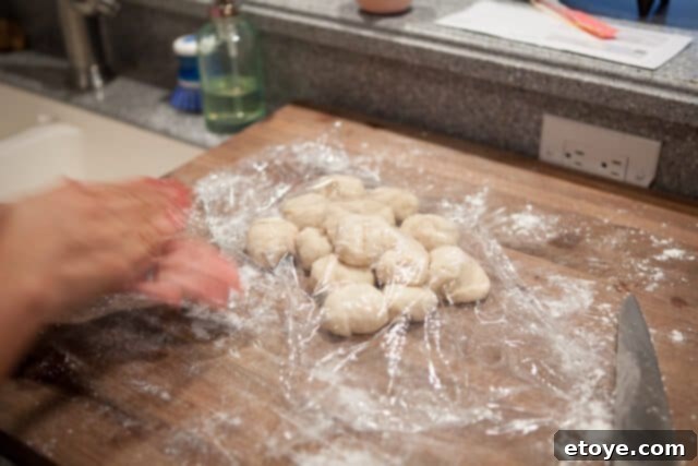Keeping Dough Covered and Moist Covered Dough Balls - Dough balls covered with plastic wrap