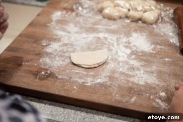 Folding Dough into Steamed Bun Shape Dough Folded into Half Circle - Oval dough folded in half