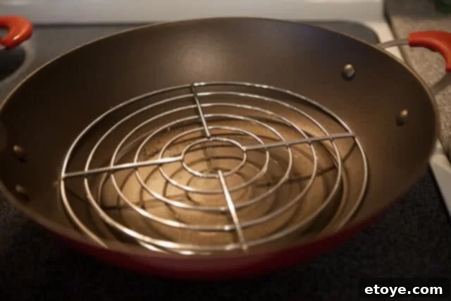 Preparing the Steamer Setup Wok Setup for Steaming - Wok with water and steaming rack inside