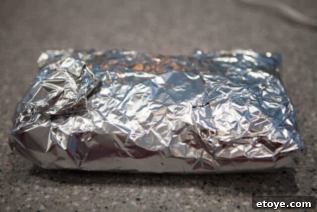 Wrapping Pork Belly for Slow Roasting Foil Wrapped Pork Belly - Pork belly tightly wrapped in aluminum foil