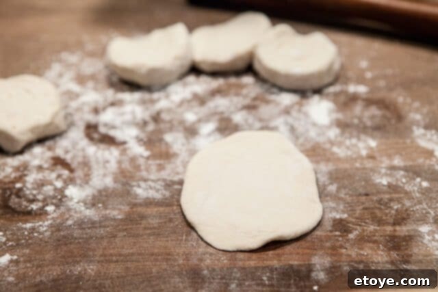Rolling Biscuit Dough for Buns Oval Biscuit Dough - Biscuit dough rolled into an oval shape