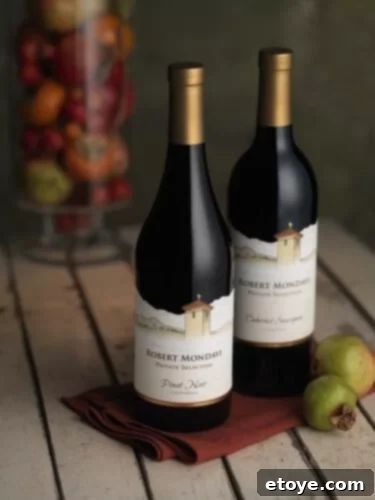 Robert-Mondavi-Private-Selection Robert Mondavi Private Selection Bottle against a scenic Central Coast vineyard backdrop