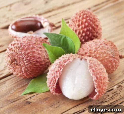Close-up of vibrant, exotic Lychee fruits, showcasing their unique texture and appealing color