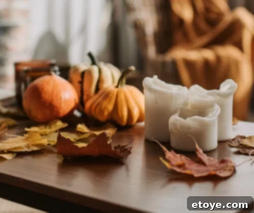Embrace the breathtaking palette of fall by collecting and utilizing vibrant leaves to adorn your tablescape.