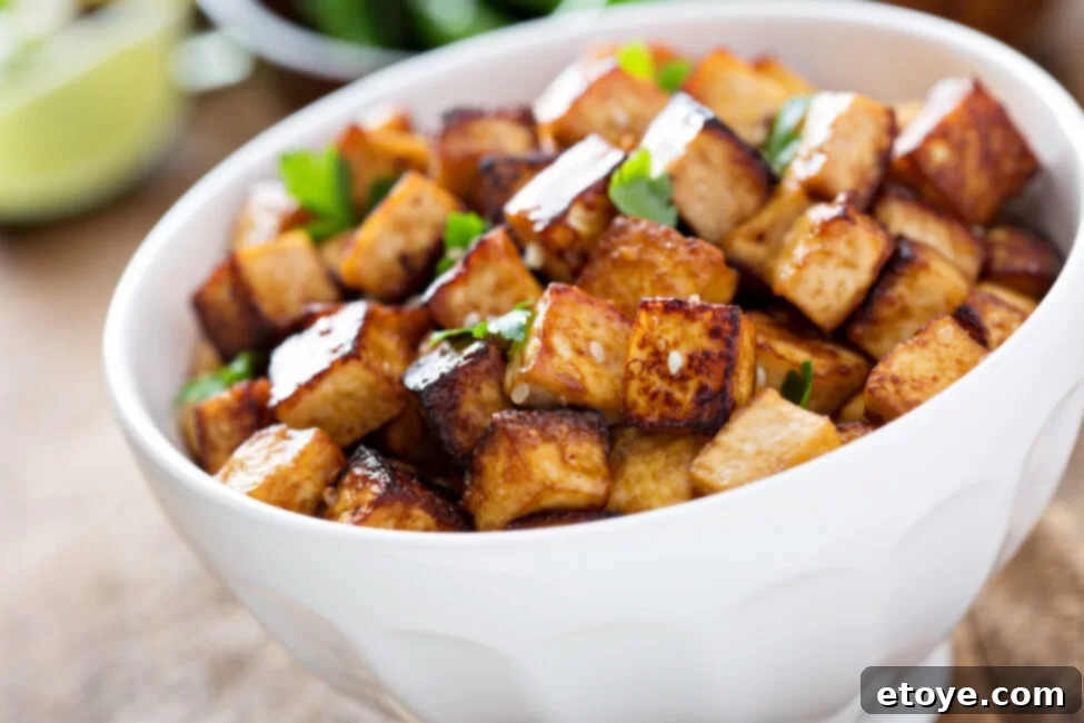 Mastering Tofu A Versatile Cooking Guide 2 Stir fried tofu in a bowl with sesame and greens