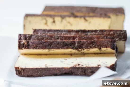 Mastering Tofu A Versatile Cooking Guide 6 Sliced Smoked Tofu on paper and white background