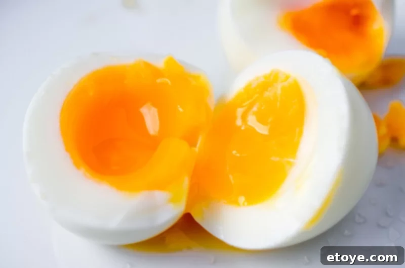 Perfectly Cooked Eggs: Soft and Hard Boiled Methods 6 Soft boiled egg cut in half