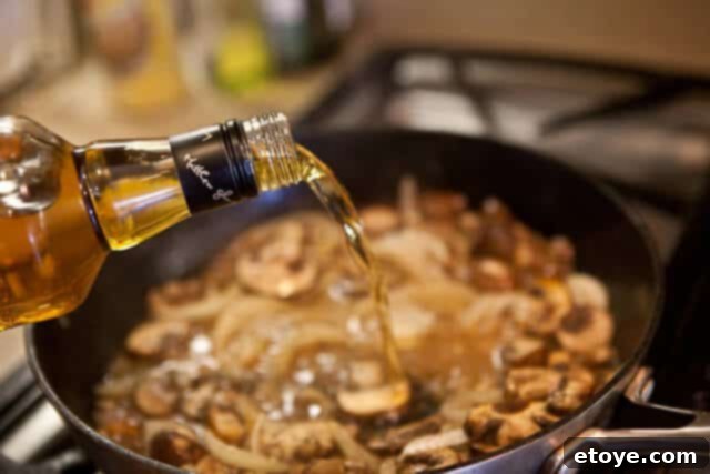 Velvet Boozy Mushroom Sauce 4 Ingredients for creamy mushroom sauce, including fresh mushrooms, cream, and herbs