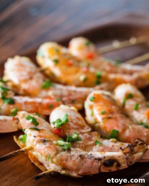 6 Creative Shrimp Recipes 6 Grilled shrimp skewers with char marks.