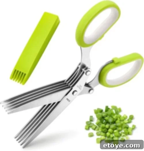 Stainless steel 5-blade herb scissors with vibrant green handles, accompanied by a matching green cleaning comb. Chopped green herbs are showcased nearby, demonstrating the scissors' precision.