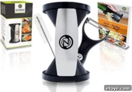 Zoodle Slicer set including the main spiralizer device in white and black, a peeler, and a recipe book, all displayed against a white background.