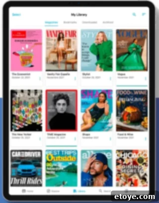 Digital library screen from Zinio showcasing an assortment of popular magazines like 'The Economist', 'Vanity Fair', and 'TIME' on a tablet display, offering a global newsstand experience.