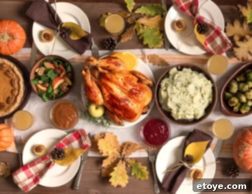 No Waste November: Your 7-Day Guide to Reinventing Thanksgiving Leftovers 2 A festive Thanksgiving day spread featuring a golden-brown roasted turkey surrounded by various holiday side dishes.