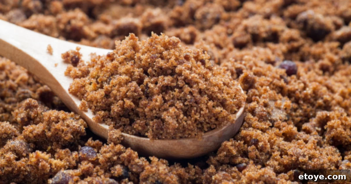 Close up of brown sugar on wooden spoon