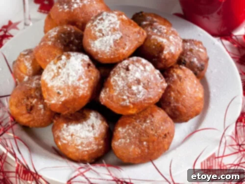 10 Global Dishes for New Year Good Fortune 5 Dutch Oliebollen, traditional New Year's Eve doughnuts dusted with powdered sugar
