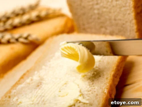 Spreading butter on toast with a butter knife