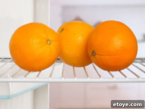 The Essential Guide To Refrigerating Fruits 2 3 oranges sit upon a rack in the fridge