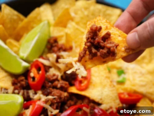 Touchdown Nachos: 8 Recipes to Win Over Your Super Bowl Crowd 5 Dive into some nachos for Super Bowl Sunday, offering a variety of flavors and styles for your party.