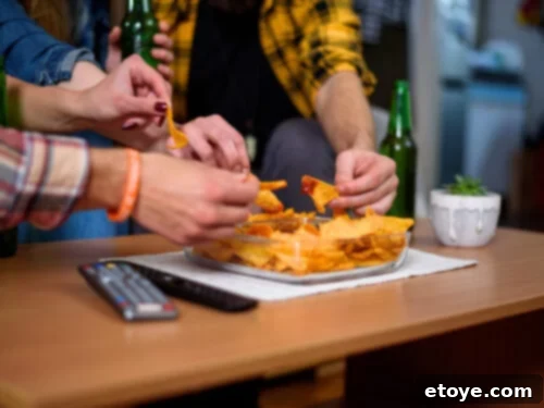 Touchdown Nachos: 8 Recipes to Win Over Your Super Bowl Crowd 3 Please your game day crowd with this diverse nacho recipe collection, featuring unique toppings and flavors.