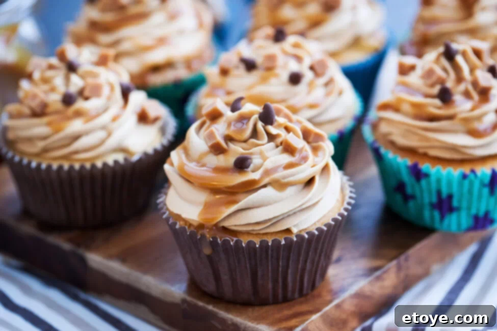 Fridge or Counter The Ultimate Cupcake Storage Guide 2 Freshly baked vanilla cupcakes with buttercream frosting on a cooling rack