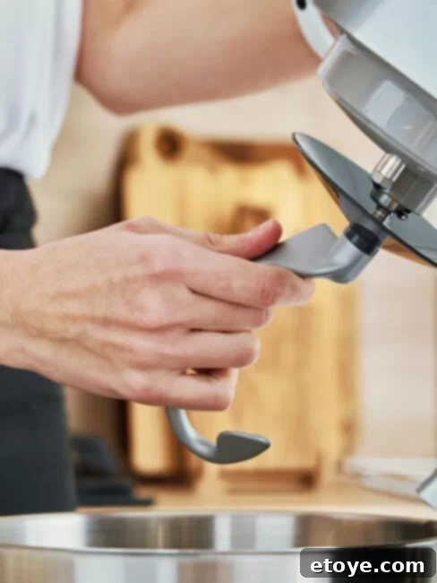 Homemade Bread Made Easy 10 Stand Mixer Recipes 3 Close-up of dough being kneaded in a stand mixer.