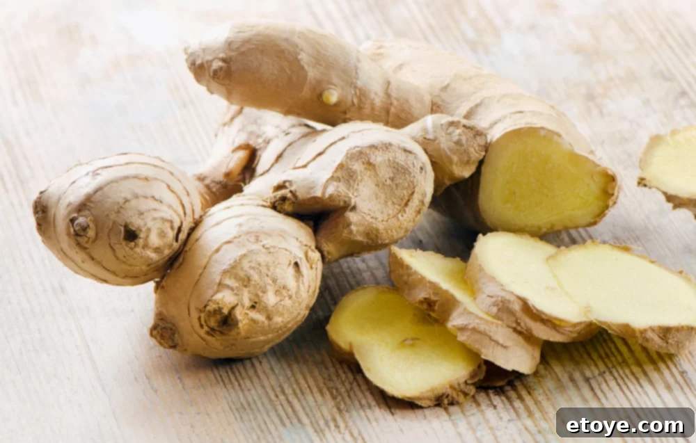Ginger Freshness Fridge and Freezer Storage 2 Fresh ginger roots displayed on a rustic wooden board, ready for use or storage.
