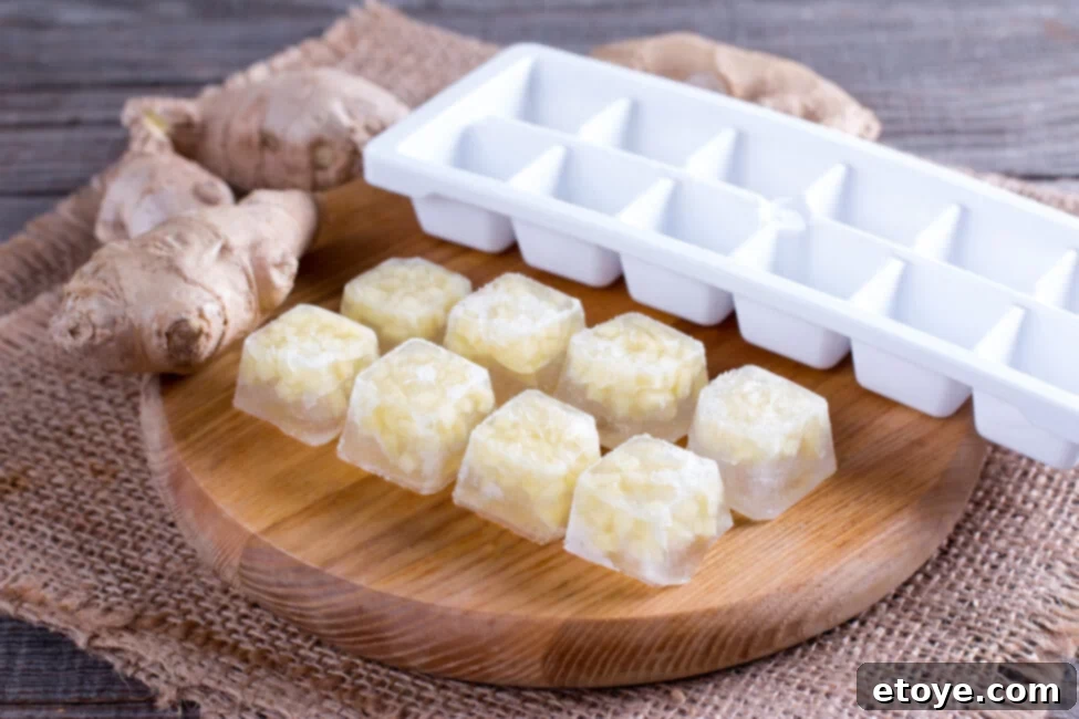 Ginger Freshness Fridge and Freezer Storage 4 Several pieces of peeled and sliced ginger on a light-colored cutting board, ready for cooking.