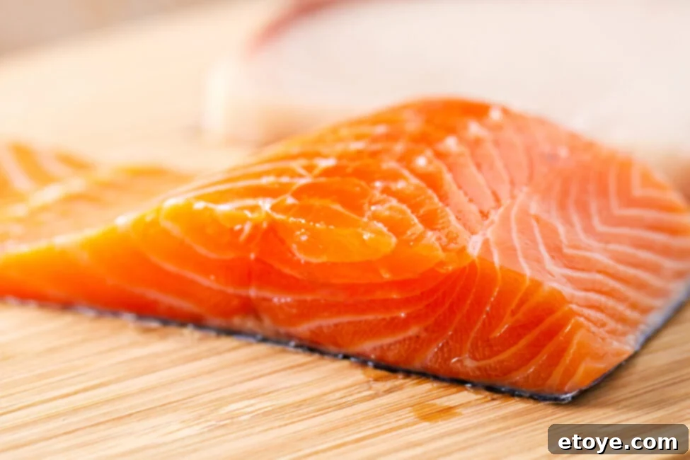 Salmon Fridge Life Explained 3 Close-up of fresh salmon slices, emphasizing texture and color.