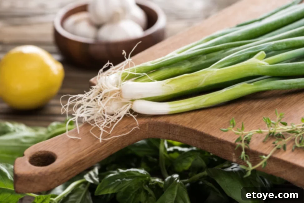 Maximize Green Onion Freshness in the Fridge 3 Close-up of spoiled green onions with yellowing, slime, and dark spots, illustrating signs of going bad.