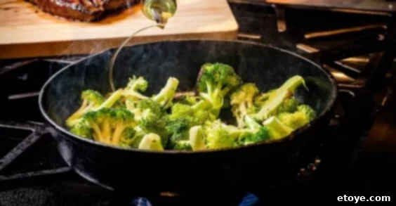 Top 5 Online Cooking Programs to Master Your Kitchen Skills 6 Fresh green vegetables being sautéed in a pan, demonstrating a core cooking skill.