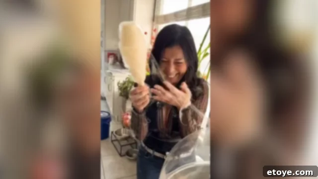 Jaden tangled in cotton candy webs, laughing