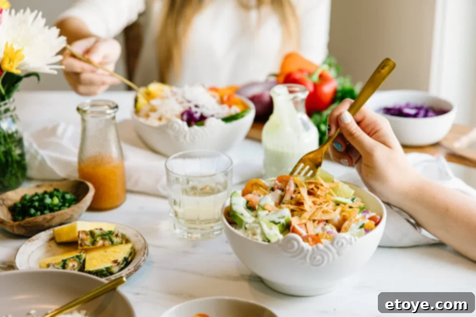 A close-up of a person's hands holding a bowl of fresh, healthy ingredients, symbolizing mindful eating and gratitude.