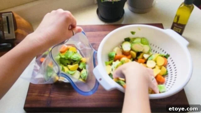Chopped veggies going into a baggie