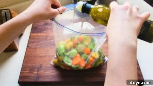 Adding Benissimo oil to chopped veggies