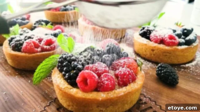 Sprinkling some powdered sugar on my lemon cookie tart