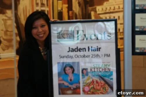 The elegant cover of The Steamy Kitchen Cookbook, showcasing a beautifully plated dish, symbolizing a major achievement in the brand's journey.