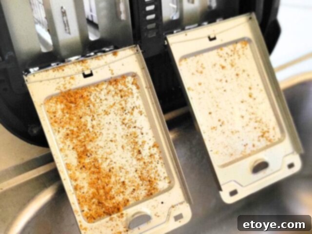 Empty toaster crumbs into sink